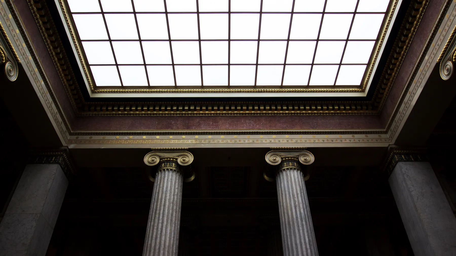 Fluted stone columns inside a classical civic building